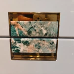 High-Gloss White Tall Sideboard Cabinet with Five Drawers Green Stone Inlay Pulls Rounded Corners and Gold-Tone Stainless Steel Base